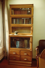 Photo of old bookcase with leaded-glass doors at CP ARchives.